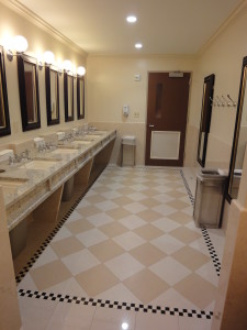 new york athletic club. Talisen Construction Management & General Contracting: Custom stone tile with diamond patterns of white and beige. Marble counter tops with mirrors in dark wood trim.