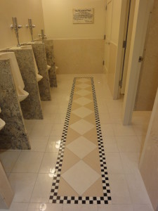 Urinals and diamond flooring and stalls.
