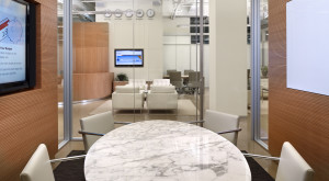 Talisen Construction Corporation: Construction Management and General Contractor. Accel Partners, 111 Eighth Avenue, New York. Talisen Construction Corporation: Construction Management and General Contractor. Accel Partners, 111 Eighth Avenue, New York. Marble table in an office area overlooking a lounge area with white chairs