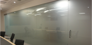 Frosted glass partition in conference room activated by electrostatic technology