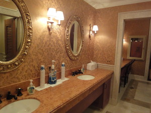 Talisen Construction Corporation: Construction Management and General Contractor. University Club, 1 West 54th Street, New York. Sink/vanity area with oval mirrors hanging above two sinks.