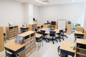 Talisen Construction Corporation: Construction Management and General Contractor. Manhattan Children's Center, 100 West 93rd Street. Classroom with many desks, student drawings and bookcases.