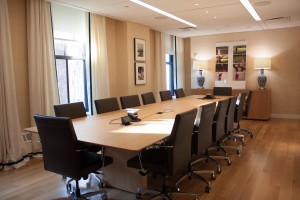 Talisen Construction: Construction Management and General Contractor. Tory Burch, 11 West 19th Street, New York. conference room with window view, wooden table, and floating ceiling
